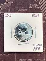 Reverse image showing caribou design and denomination on the 2016 Canadian silver proof 25 cents coin enclosed in a white cardboard holder.