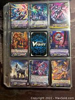 Page of nine VanGuard trading cards showing colorful character artwork, text, and symbols.
