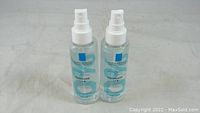 Two bottles of La Roche-Posay Toleriane Ultra 8 Daily Soothing Concentrate Face Moisturizer positioned upright showing front labels and spray pumps.