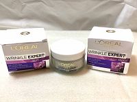 Two unopened jars of L'Oréal Paris Wrinkle Expert Anti-Wrinkle Night Moisturizer with their boxes displayed.