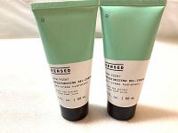 Two tubes of Versed Dew Point Moisturizing Gel-Cream placed next to each other on a white surface, front label visible showing branding and volume information.