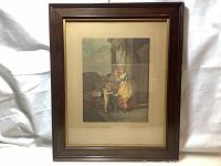 Full image of antique framed color print with mat and dark wooden frame on white background.