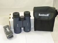 Bushnell H2O binoculars with carrying case, cleaning cloth, and box.