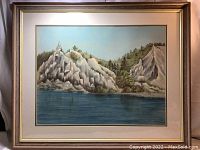 Framed landscape drawing showing Scarborough Bluffs with cliffs, trees, water, and sky.