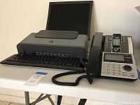 Canon Pixma iP1700 printer, RCA corded phone, Vtech cordless phone with base, and keyboard not included