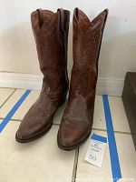 Front view showing pointed toe and shaft with stitched design.