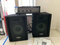 Wide view showing mixer positioned atop two speakers