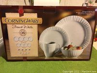Box front showing CorningWare French White 16-piece set with microwave and dishwasher safe labels.