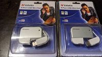 Two Verbatim 4-Port USB Mini Hubs in original unopened packaging showing front view, USB connector, and packaging design