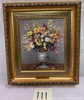 Full view of framed oil painting showing floral still life