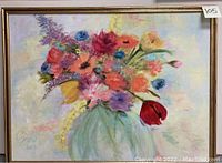 Framed oil on canvas painting of colorful flowers in a vase, signed by artist Cindy Ruiz in lower left corner.