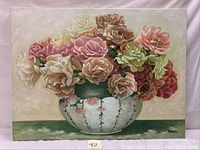 Full view of floral still life oil painting on canvas showing the bouquet of various colored roses in a ceramic bowl with the artist's signature visible.