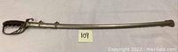 Full view of sword sheathed in silver-tone metal scabbard