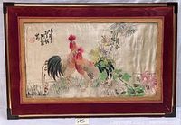 Full view of the framed embroidery artwork showing two roosters and floral motifs on silk with wooden frame and corner protectors.