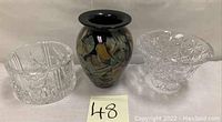 Three items shown side-by-side: Waterford crystal footed vase, spatter art glass vase, and champagne coaster holder chiller.