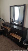 Front view of the dresser with open drawers and mirror on top, showing the dark wood finish and drawer pulls.