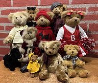 Lot of 9 Bearington Collection teddy bears in various themed outfits posed together against a brick background.