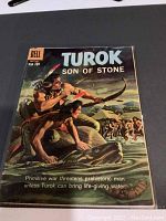 Front cover of Dell Comic Turok Son of Stone issue No 21 from 1960 showing prehistoric artwork and title details.