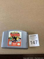 Photo of Nintendo 64 game cartridge Pokémon Snap showing front label with game title and graphics.