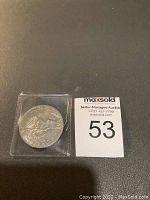 Back side of 1972 USA silver dollar coin showing eagle design.