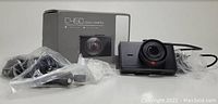 Photo of Apeman C450 dash camera with accessories and packaging