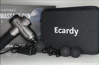 Ecardy branded portable massage gun with power cable, five distinct massage heads, and a black carrying case shown on a gray surface with product box in background.