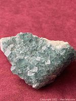 Top view of the rough fluorite crystal formation showing the overall shape and cubic crystal structure.