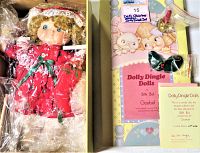 Full view of Dolly Dingle doll in original packaging along with certificate and accessories