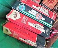 Photo of boxed Lee narrow electric door strikes showing retail packaging and product graphics