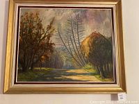 Full view of framed oil painting depicting nature scene with trees and path