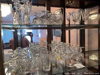 Shelf view showing groups of short tumblers and medium stemware