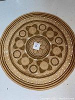 Full top view of the round jute rug showing overall pattern and shape.