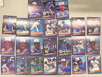 Collection of 24 Donruss 1986 Toronto Blue Jays baseball cards laid out in rows showing players in action poses and portraits.