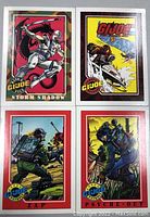 Front of four GI Joe trading cards showing illustrated characters Storm Shadow, Zap, Psyche-Out, and a scene from Famous Battles Alaska Pipeline Battle.