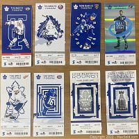 Front view of eight attached pairs of Toronto Maple Leafs season tickets showing player images and event information.