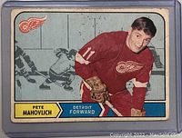 Front side of the 1968-69 O-Pee-Chee Pete Mahovlich hockey card. Shows player in red Detroit Red Wings uniform, card number 143.