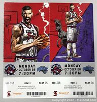 Two full ticket stubs side by side showing detailed artwork of Toronto Raptors player with basketball and team logos, date and seat info for seats 15 and 16 Section 318 Row 1.