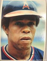 Close-up photo of Rod Carew card showing him in California Angels cap and navy uniform.