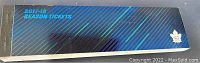 Top side of the ticket book showing 2017-18 season tickets text and maple leaf logo in metallic print.