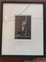 Full front view of framed engraving showing mat, frame, and cracked glass