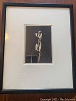 Front view of framed wood engraving art showing the full piece with matting and frame.