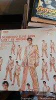 Cover of vinyl album '50,000,000 Elvis Fans Can't Be Wrong' showing Elvis Presley in a gold suit multiple times on the cover