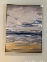 Full view of abstract landscape painting with clouds and water in muted tones, framed and hung on wall.