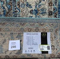 Label showing Heritage Collection branding, material, dimensions and origin