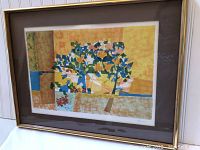 Framed abstract lithograph artwork by Fausto Cauri, showing colorful cubist style with geometric patterns and stylized trees.
