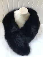 Photo showing entire black mink fur stole on a mannequin torso with thick glossy fur texture.