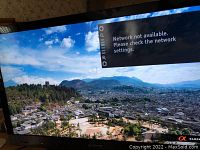 Front screen display showing scenic outdoor image with network error message overlay.