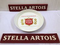 Full set showing two Stella Artois bar mats and Lone Star Beer serving tray