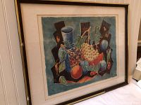 Framed lithograph showing abstract still life with grapes, cherries, other fruits, and geometric shapes.