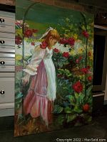 Full front view of the oil painting propped against kitchen cabinets